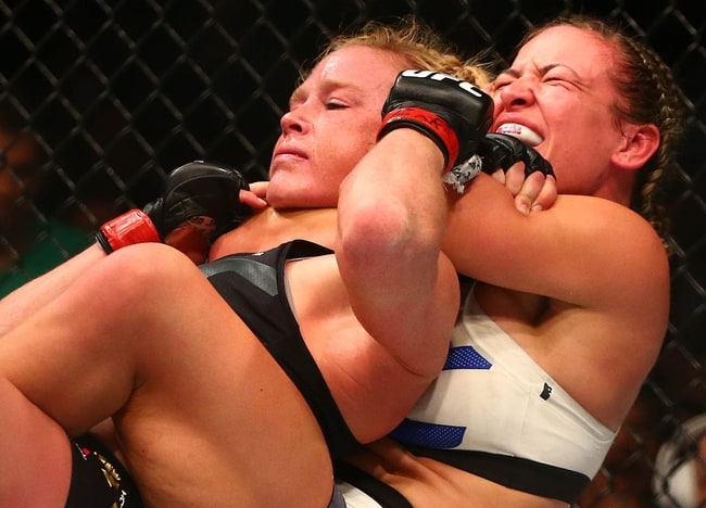 March 5, 2016; Las Vegas, NV, USA; Miesha Tate applies a chokehold to win by submission against Holly Holm during UFC 196 at MGM Grand Garden Arena. Mandatory Credit: Mark J. Rebilas-USA TODAY Sports